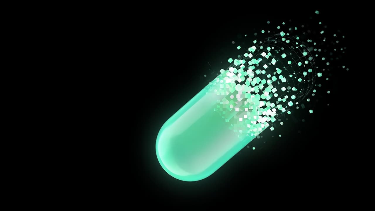 A mint-green capsule dissolving into floating pixels
